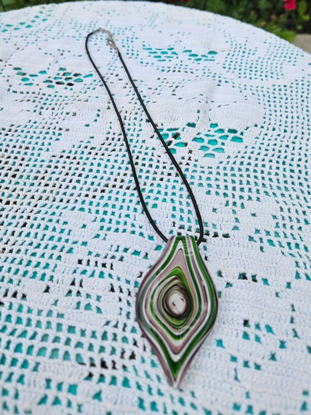 Murano-style blown glass pendant in green and pink swirl